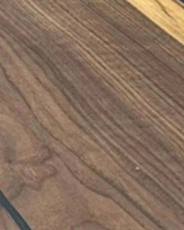 A close view of dark brown timber: walnut.