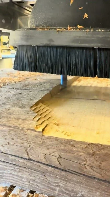 Still from the clip “A carved wall art design taking shape”.