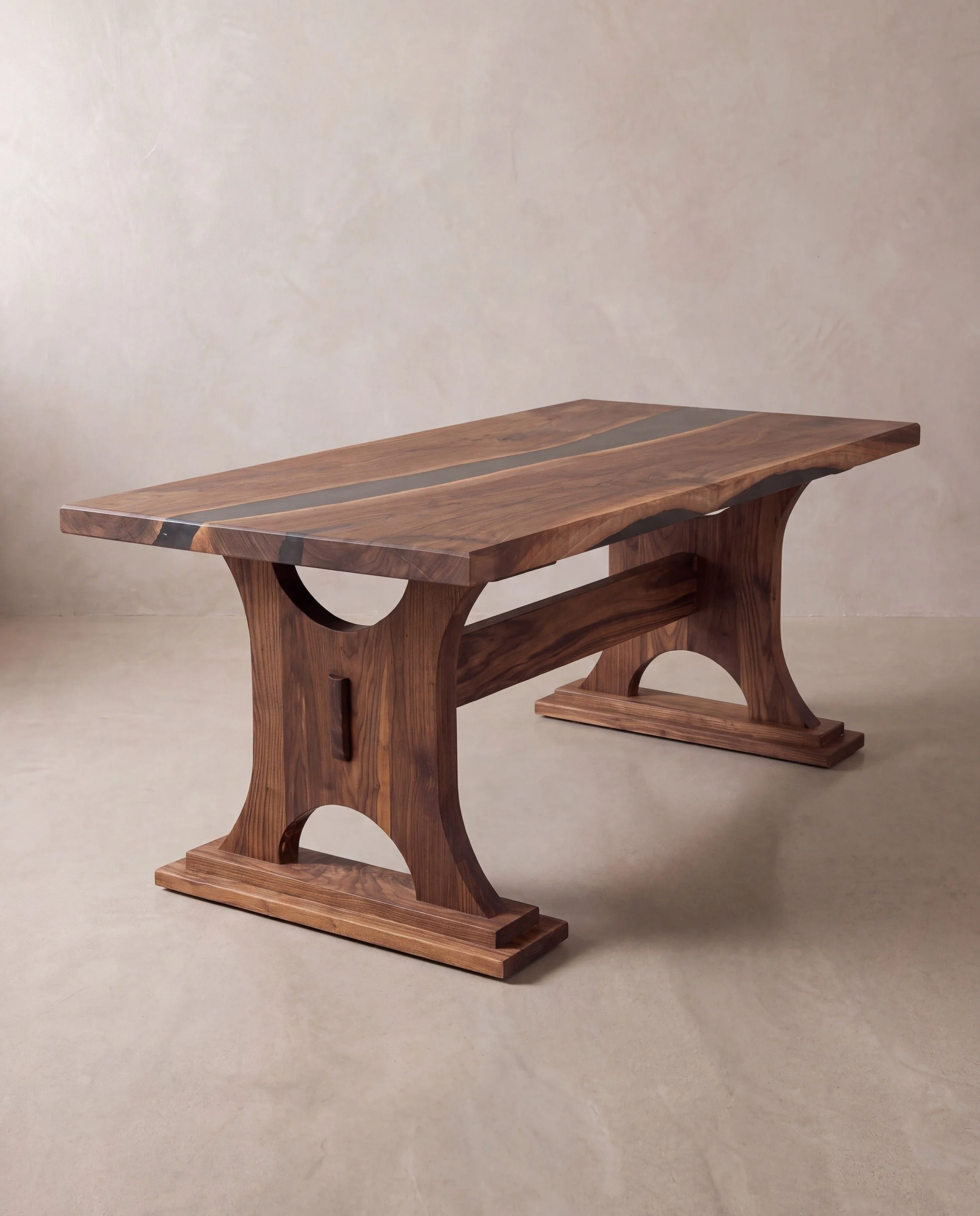 A rendering of a walnut table on trestle ends with arched cut-outs and stepped feet, in a limewash studio.