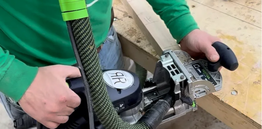Using a Festool Domino joiner to cut precise mortises for a custom wood dining table handcrafted in Geneva, Illinois.