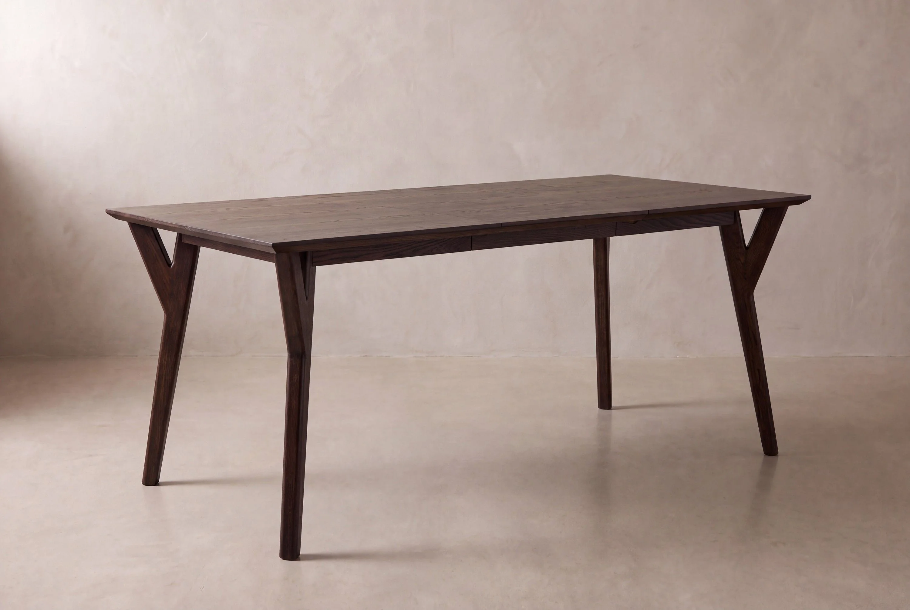 Mid-century splayed leg: a studio rendering of the collection's lead piece.