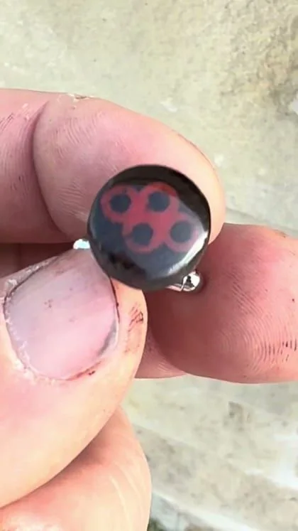 Still from the clip “Custom cufflinks”.