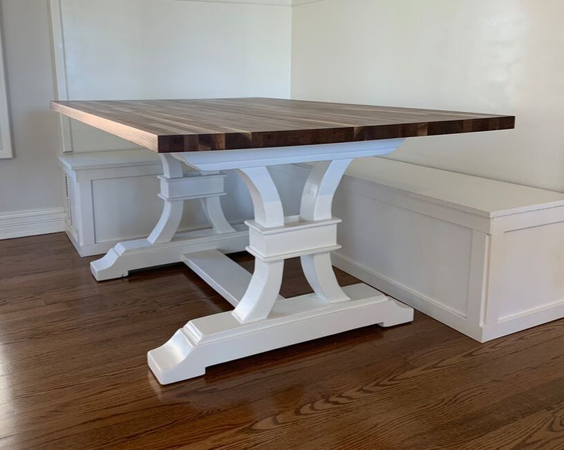 Butcher block style walnut top and white painted curved regal base to fit banquet style built in seating