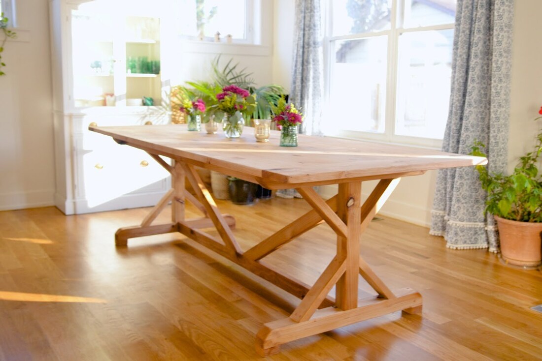 X-based farmhouse table with natural hardwax finish made from alder