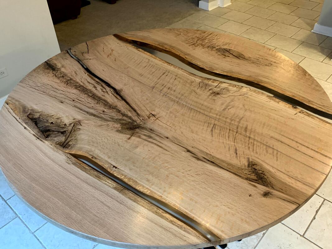 Figured white oak split leaf round dining table with clear epoxy resin river fill