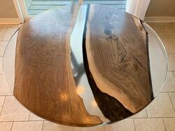 Top Image of clear epoxy resin table with Walnut